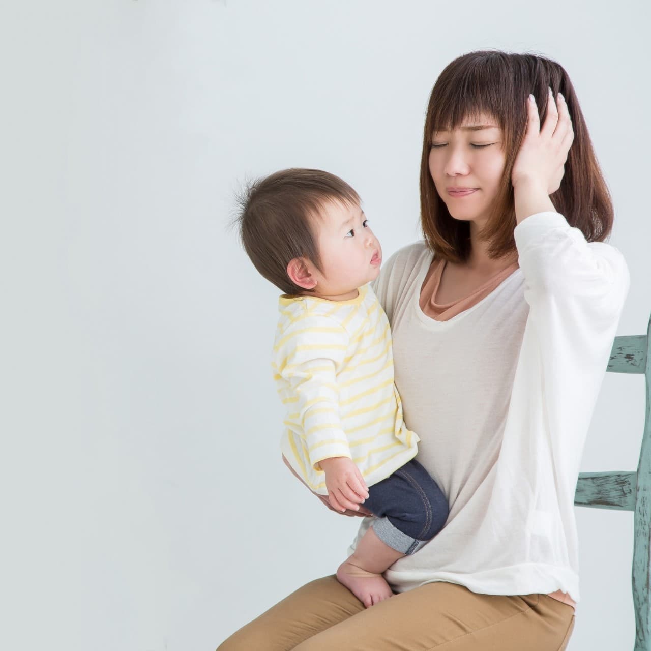 産後の不調に悩む女性